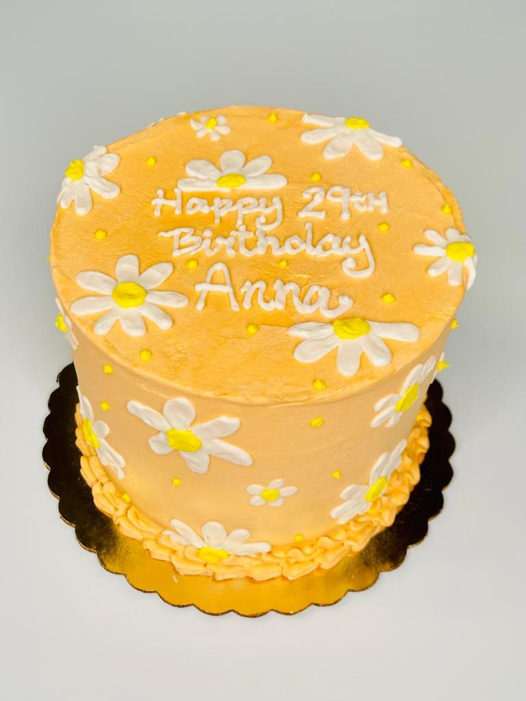 The Best Yellow Birthday Cake with Chocolate Icing - Noble Pig
